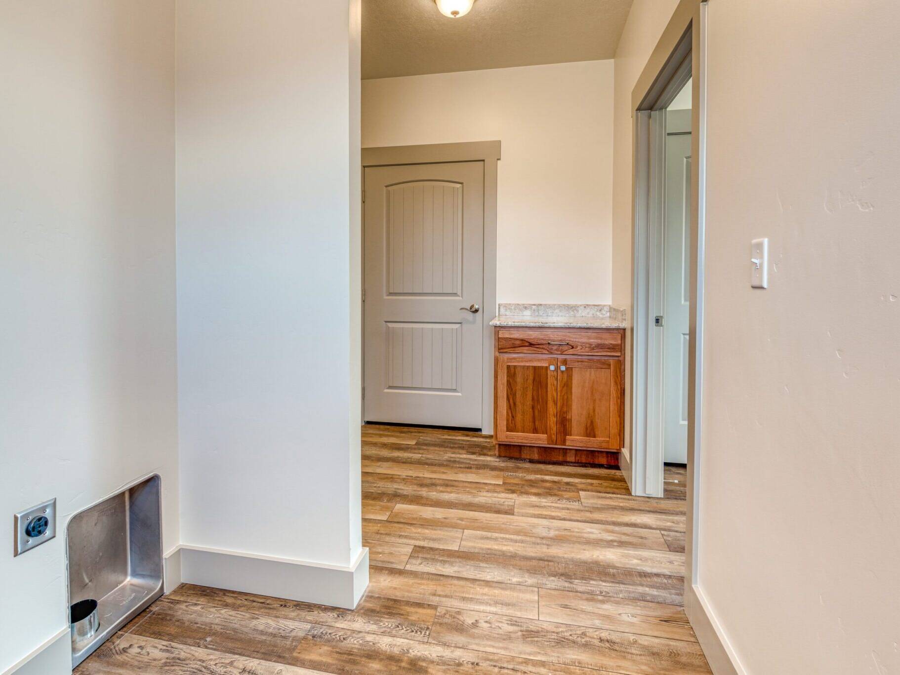 Laundry/rear foyer in the Country Cottage model home - built by Big Sky Builders in Hamilton, MT