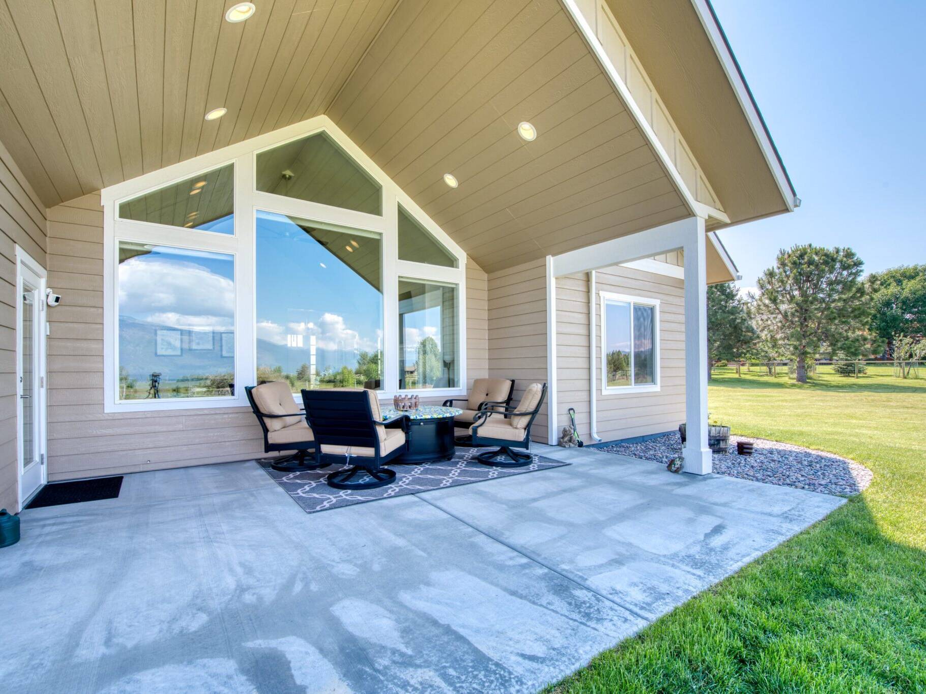 Covered back patio with vaulted ceiling overlooking the Bitterroot Valley near Hamilton, MT - Built by Big Sky Builders of Montana
