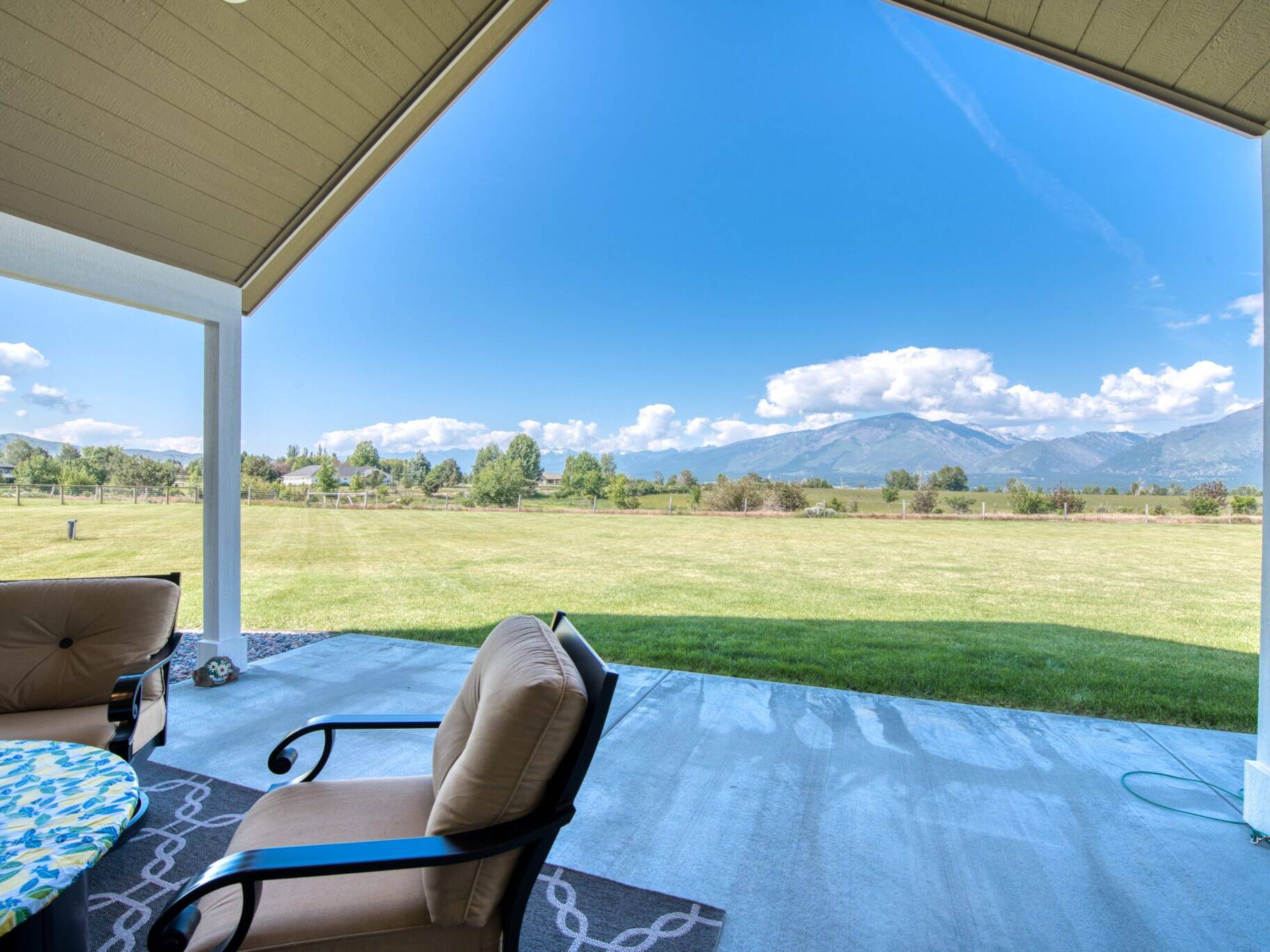 Covered back patio with vaulted ceiling overlooking the Bitterroot Valley near Hamilton, MT - Built by Big Sky Builders of Montana