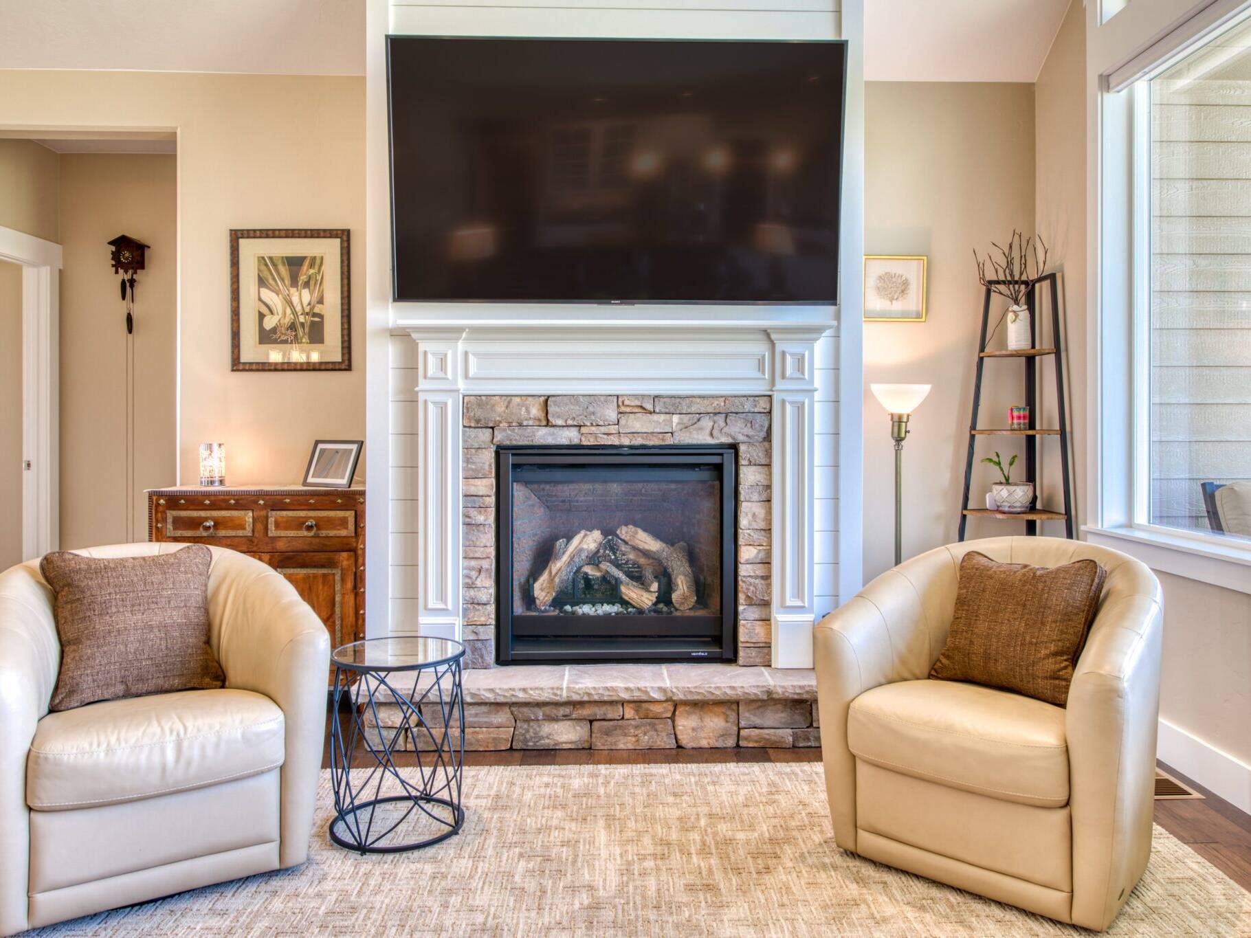 Fireplace with a TV above in a custom home built by Big Sky Builders in Hamilton, MT