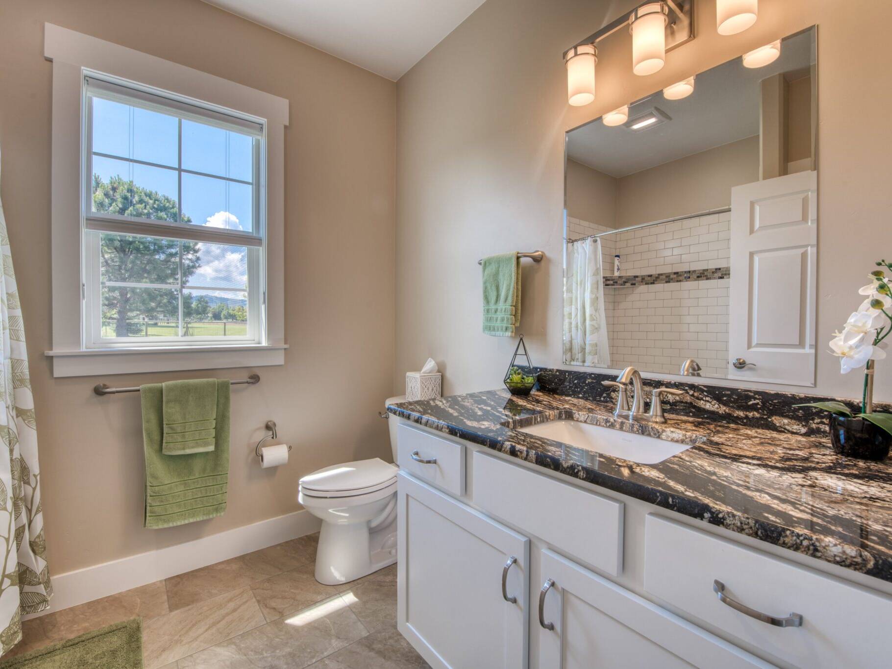 Bathroom vanity with granite countertop in a custom home built by Big Sky Builders of Montana in Hamilton, MT
