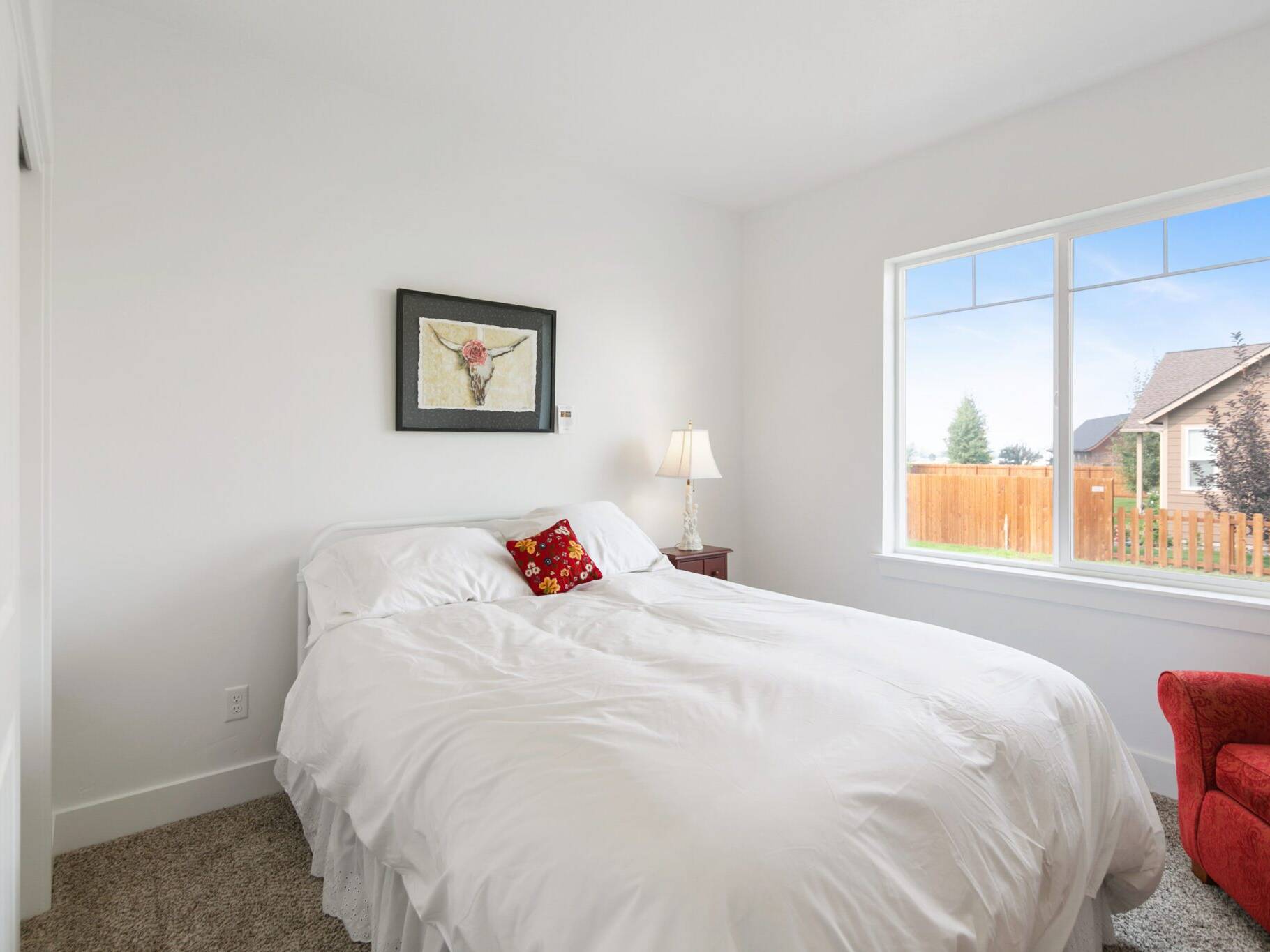 Guest bedroom in The Seeley model home - Built by Big Sky Builder in Hamilton, MT