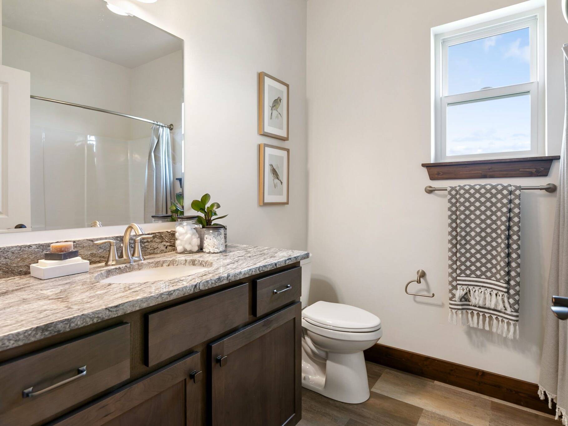 Guest bathroom in The Seeley model home - Built by Big Sky Builder in Hamilton, MT