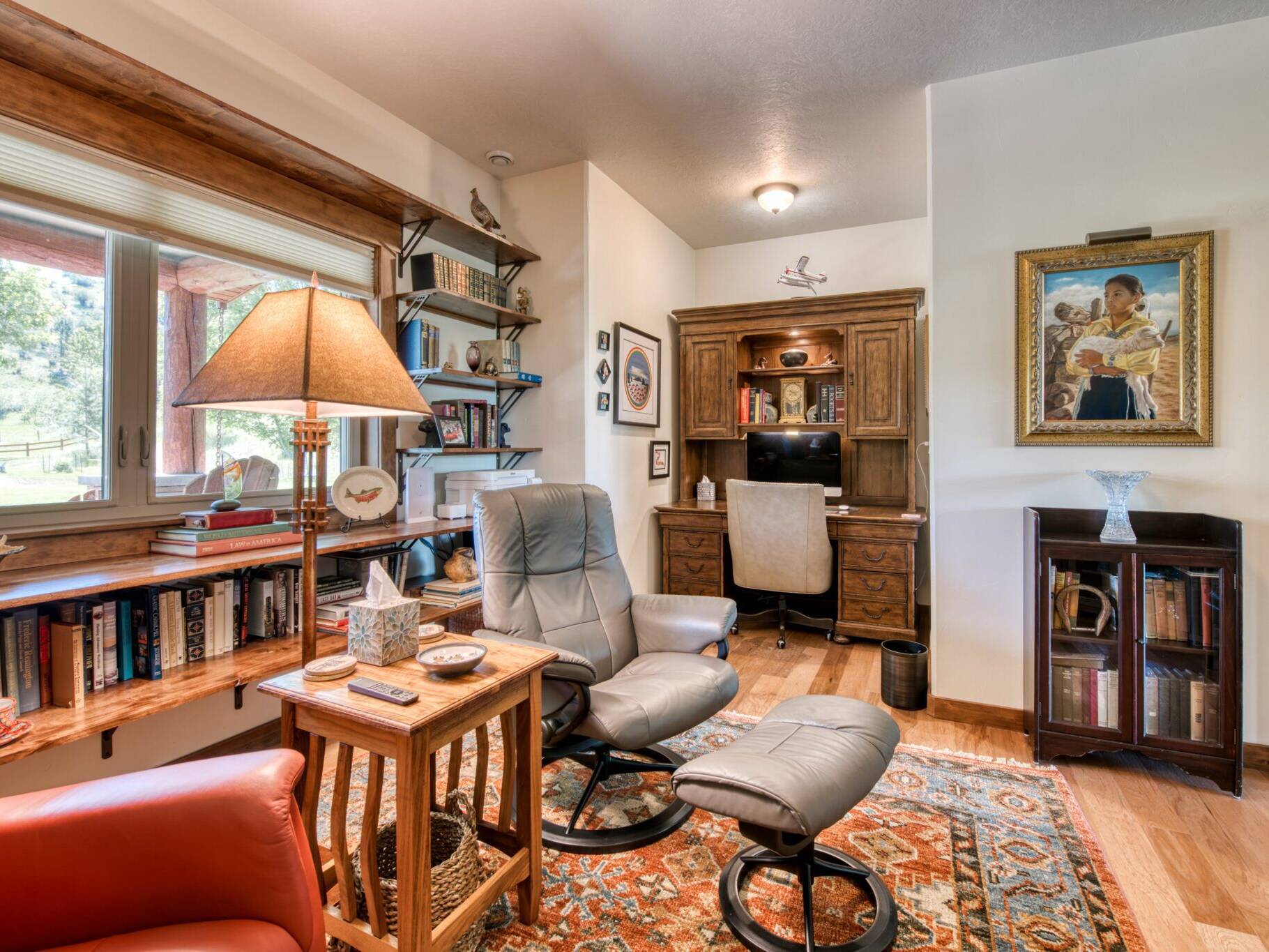 Home office with hardwood flooring, stained wood trim and doors in a custom home near Hamilton, MT