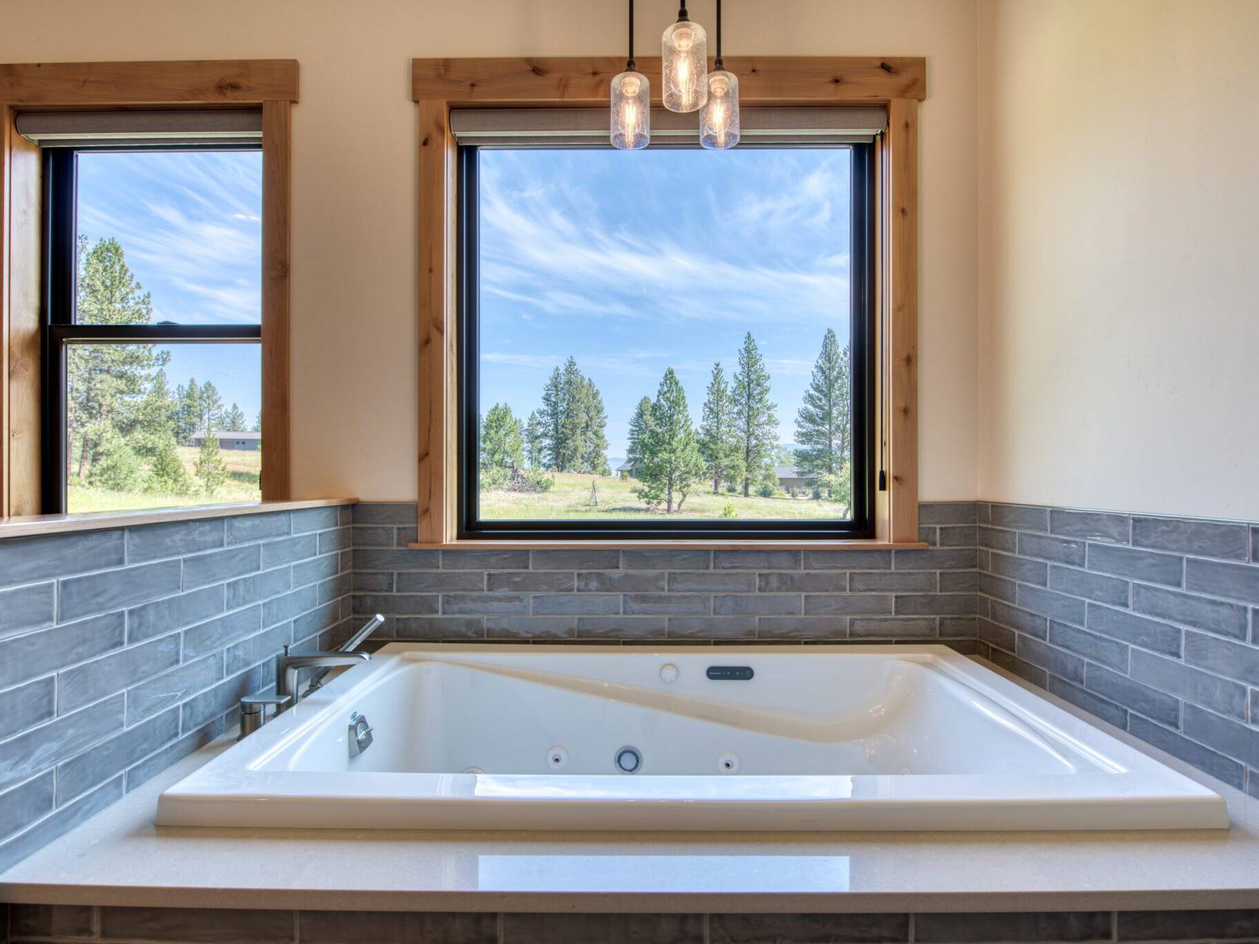 Jetted tub in a tiled tub deck in a custom home built by Big Sky Builders in Florence, MT
