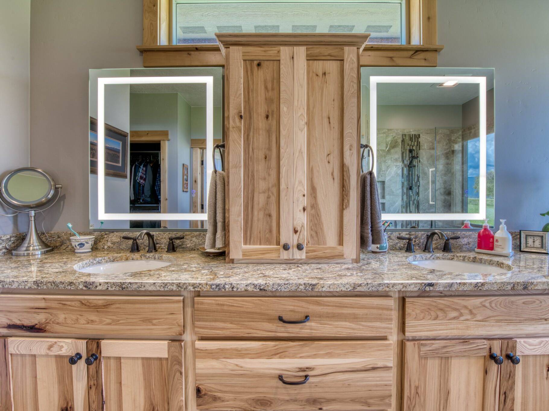 Master vanity with lighted mirrors in a custom home built by Big Sky Builders in Stevensville, MT