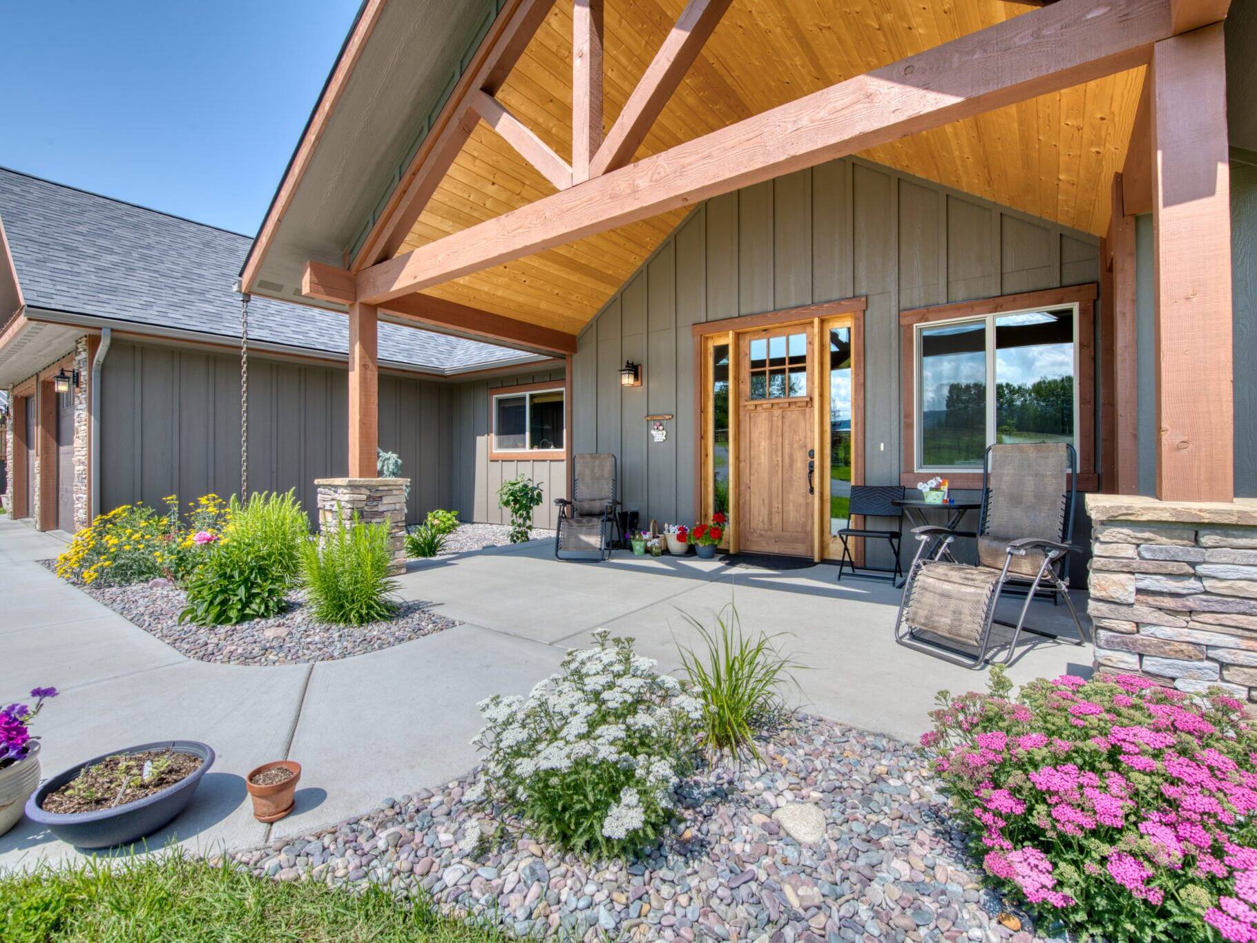 Entry door and covered front porch of a custom home built by Big Sky Builders in Stevensville, MT