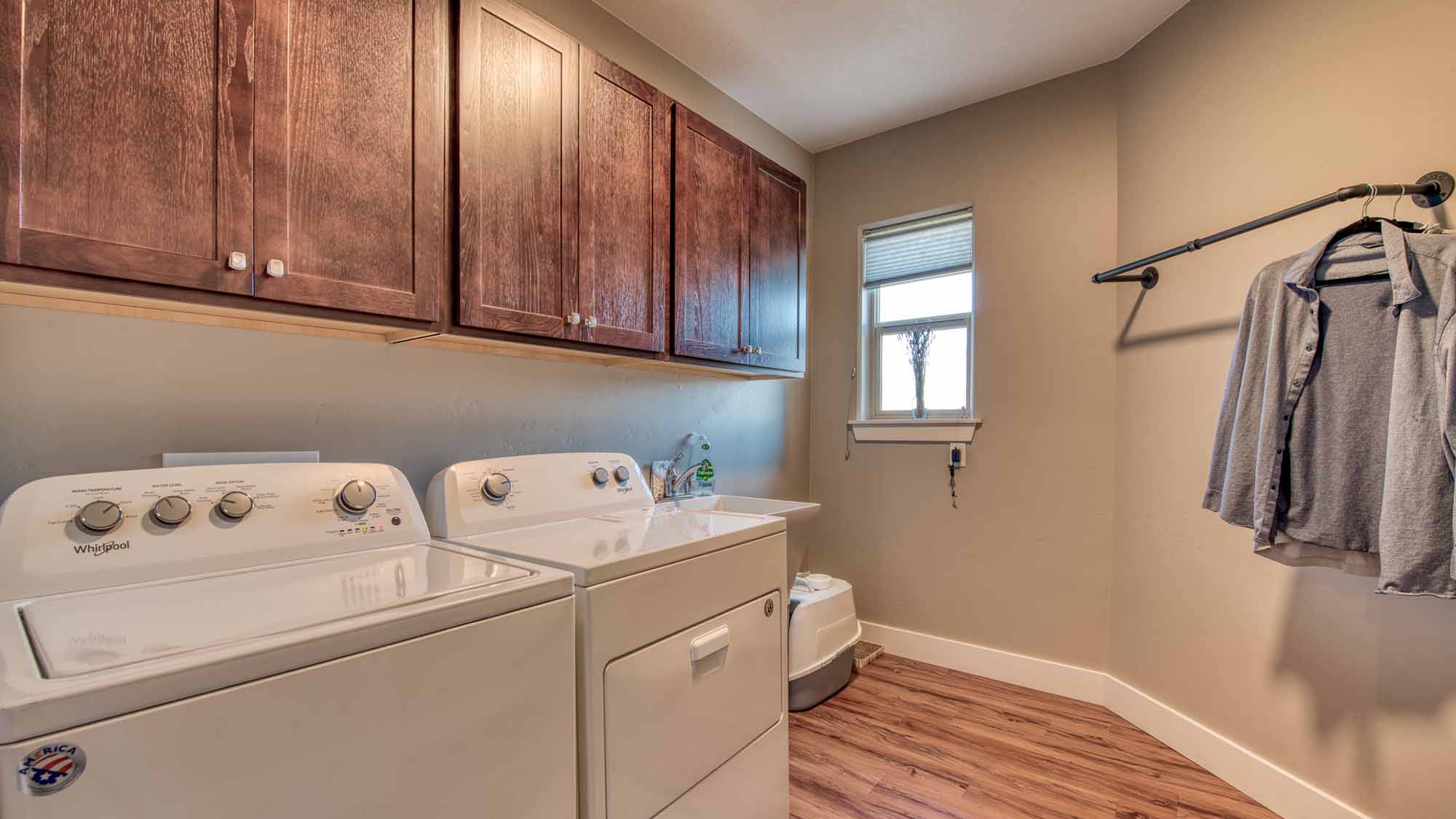Laundry room in The Copper Creek model home - Built by Big Sky Builder in Florence, MT